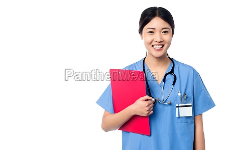 lady arzt hält zwischenablage und posieren Stock Photo 11203822