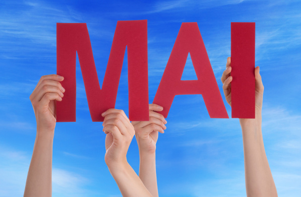 people holding straight word mai mean