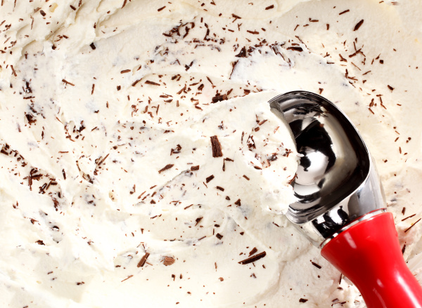 scooping vanilla ice cream with chocolate