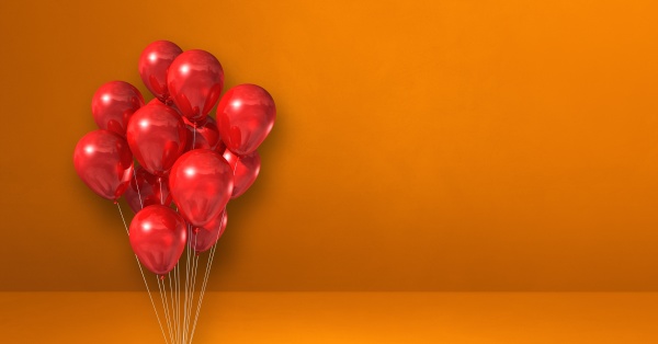rote ballons buendeln sich auf orangefarbenem