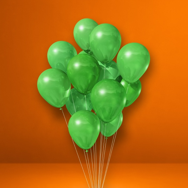 gruene ballons buendeln sich auf orangefarbenem