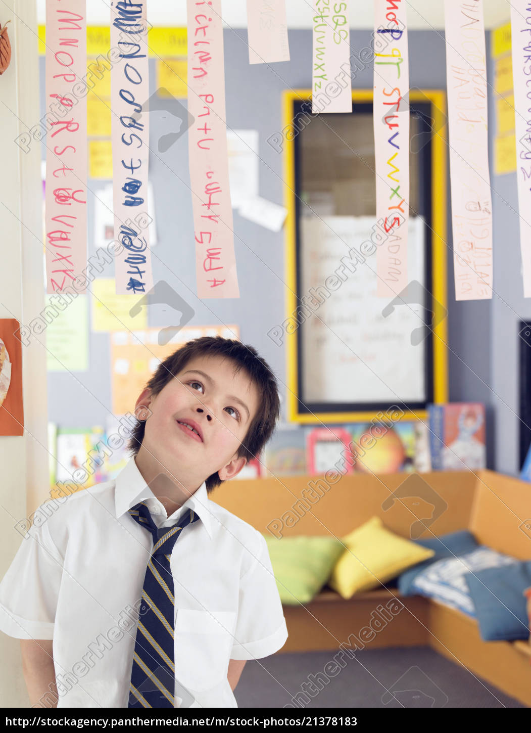 Boy Looking Up At Paper Strips In Class - Stockfoto - #21378183 ...