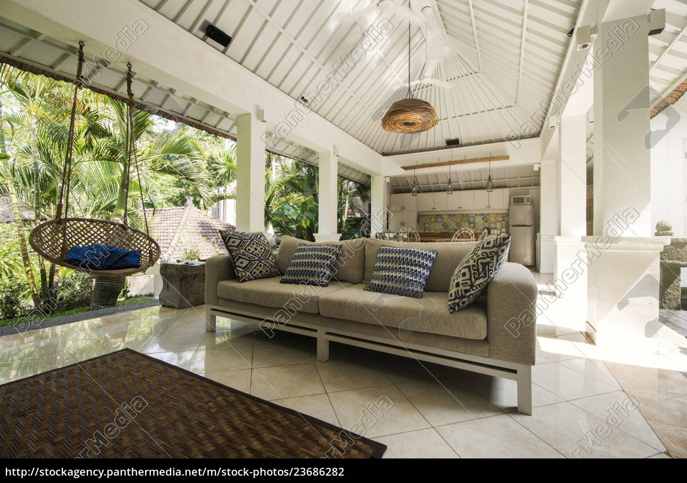 Open living area in a tropical luxury home with couch - Stock Photo ...