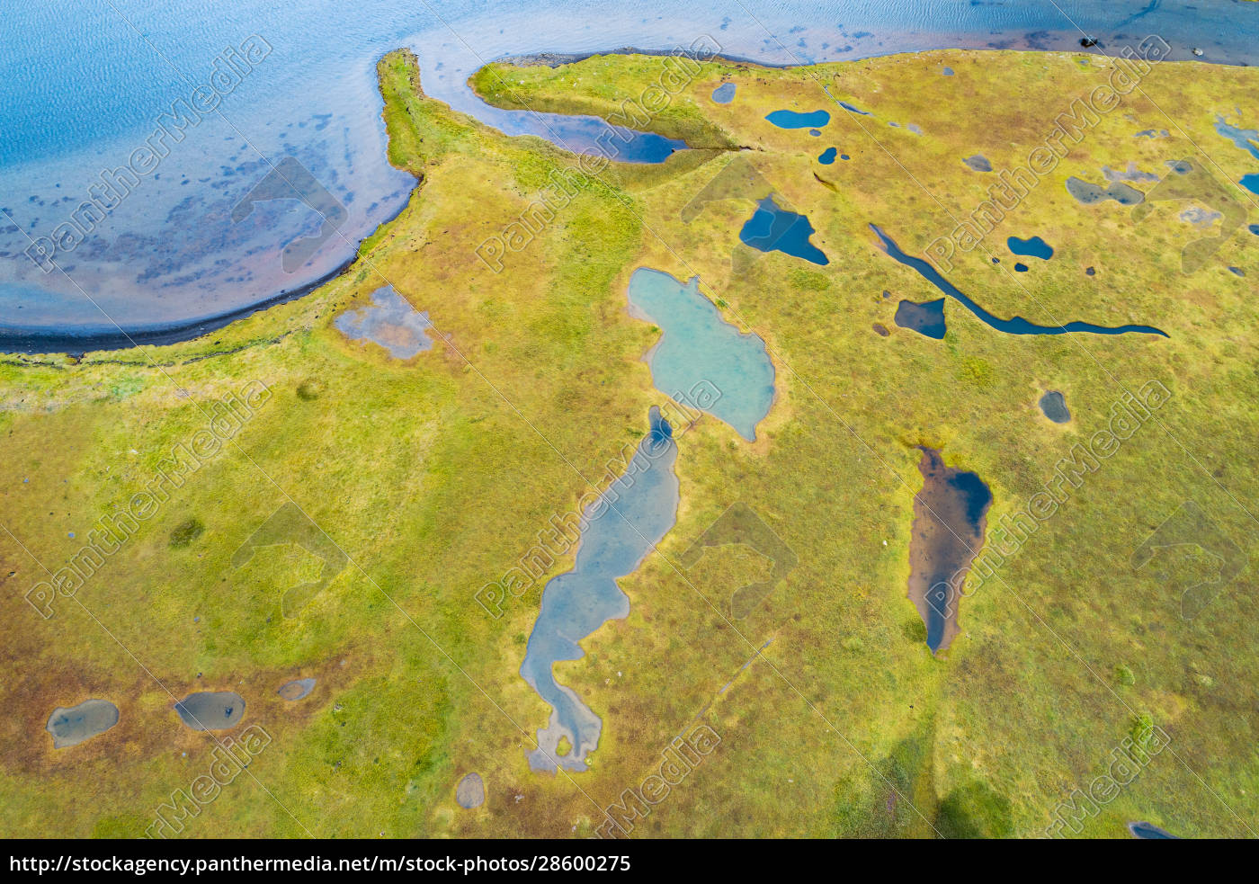 Aerial view of small lakes in grassland near a fjord - Stockfoto ...